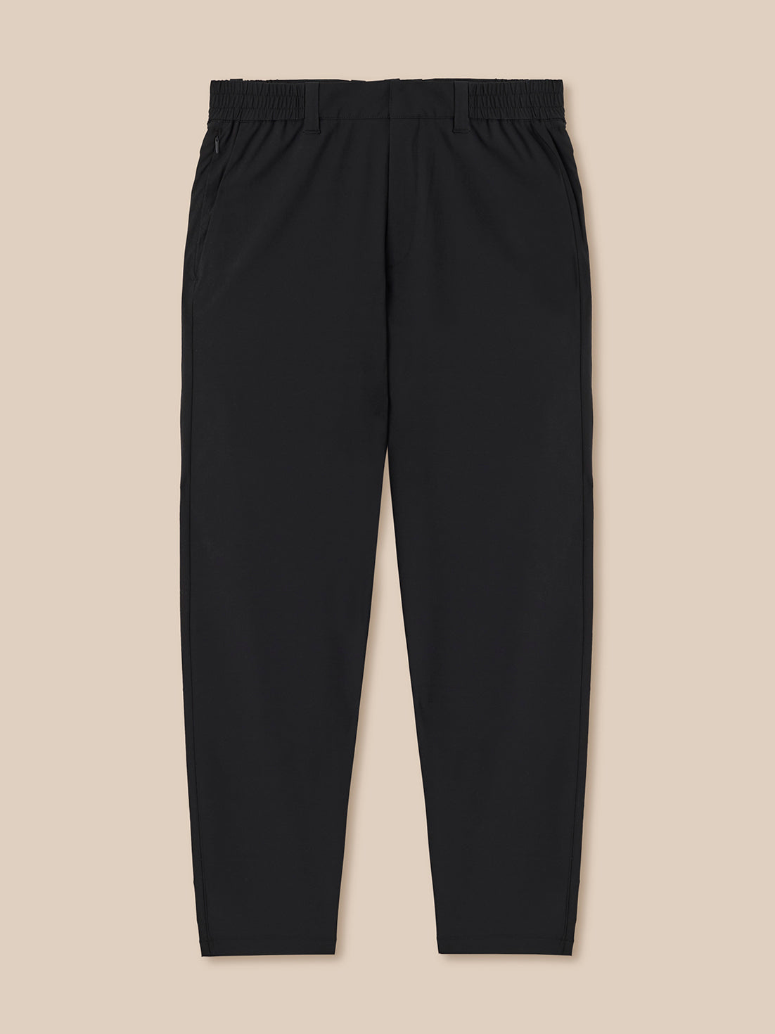 Black pants on a beige background