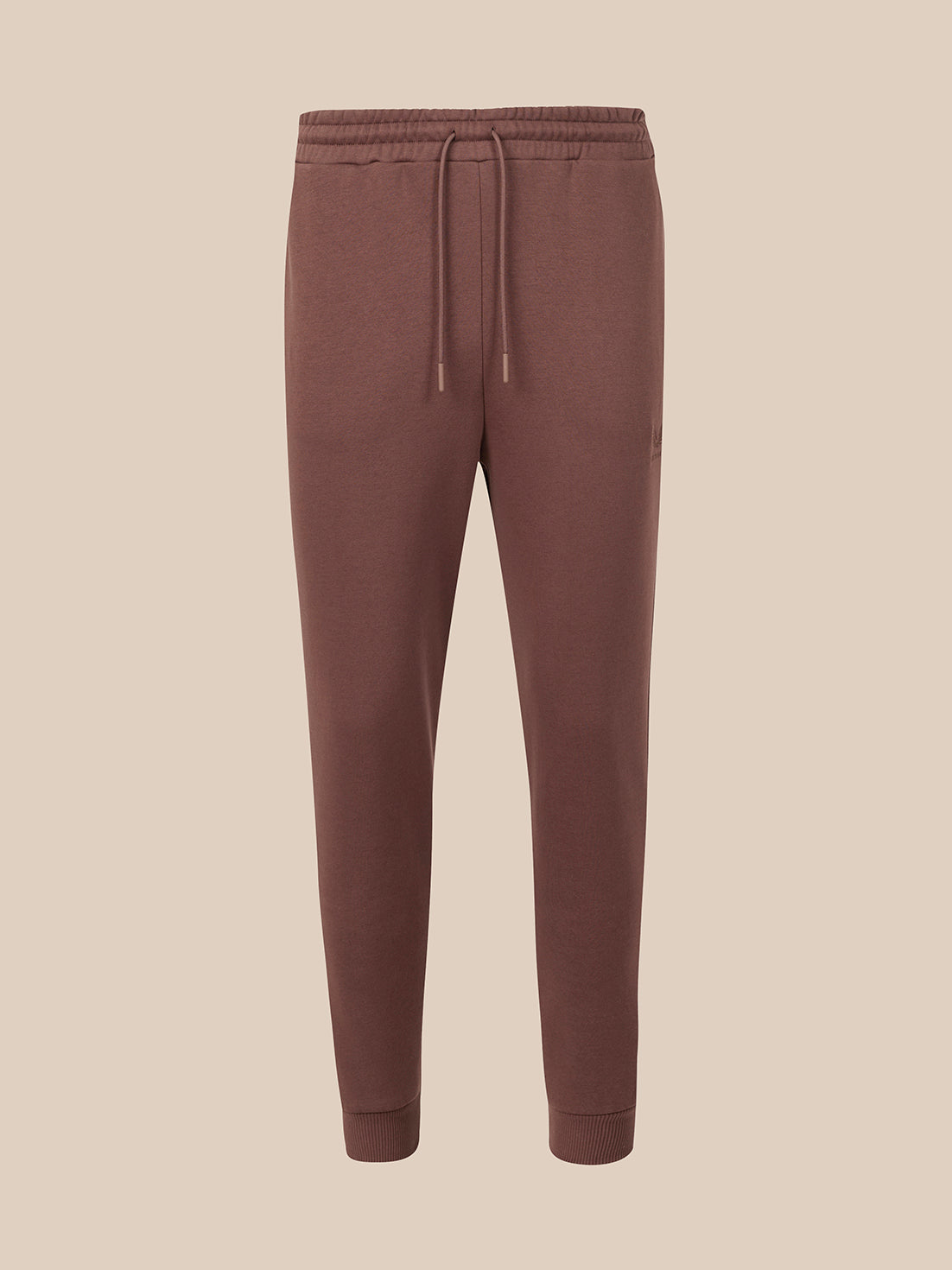 Deep mahogany pants on a light gray background