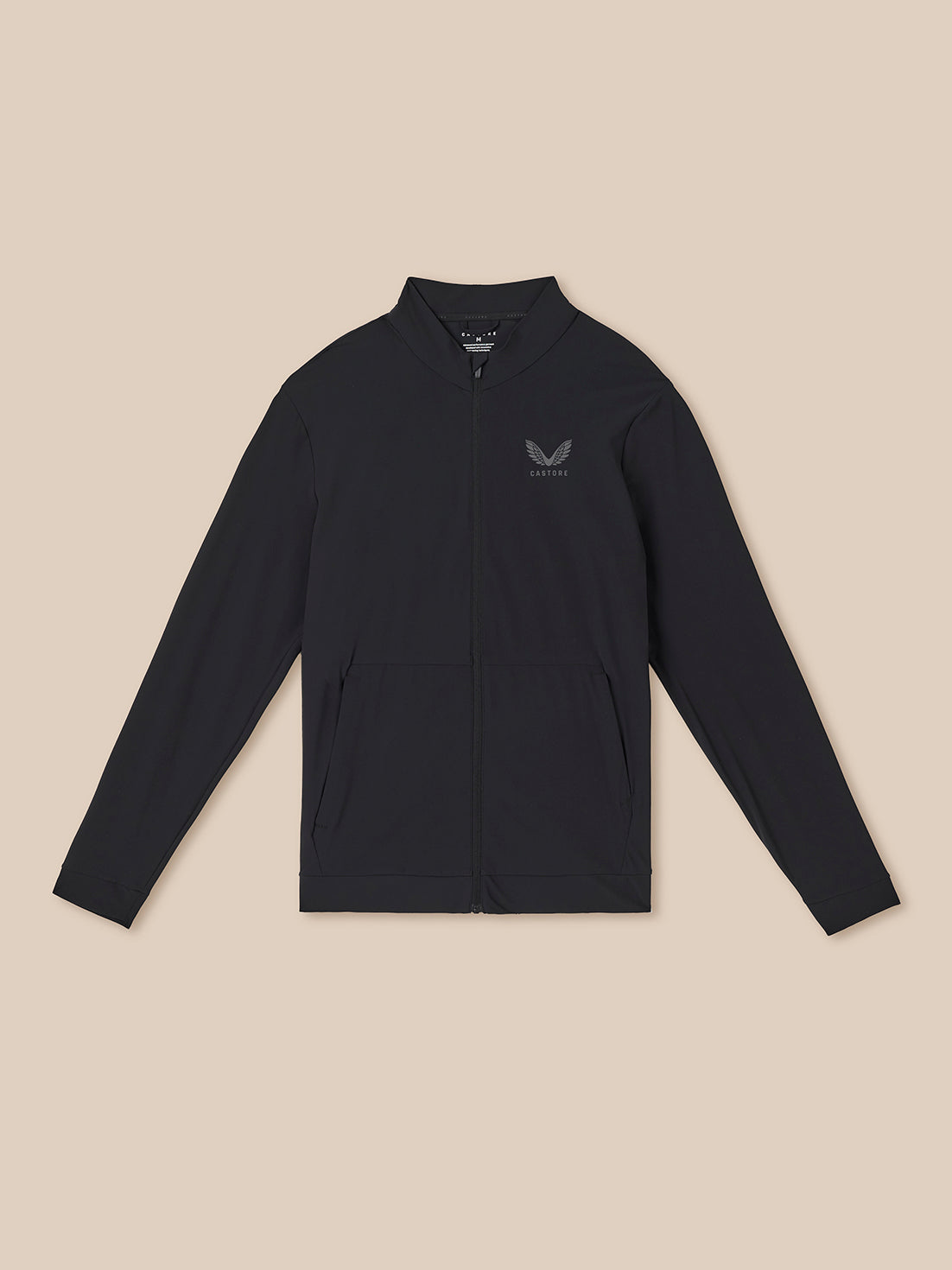 Black long-sleeve shirt with a small logo on a beige background