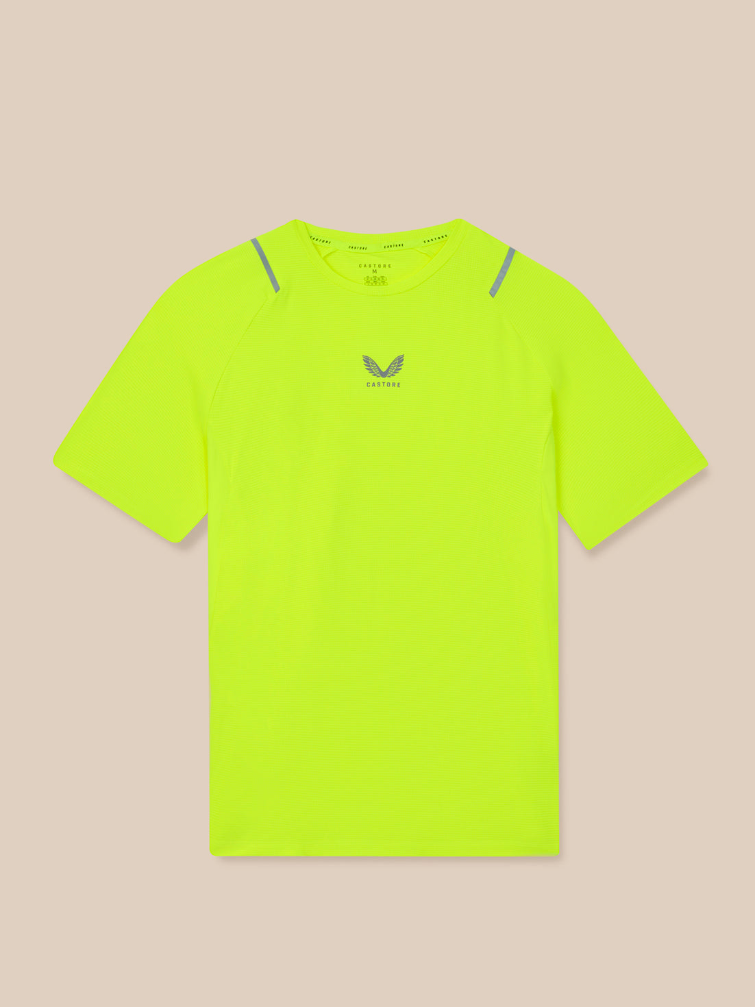 Bright yellow t-shirt with a brand logo on a beige background