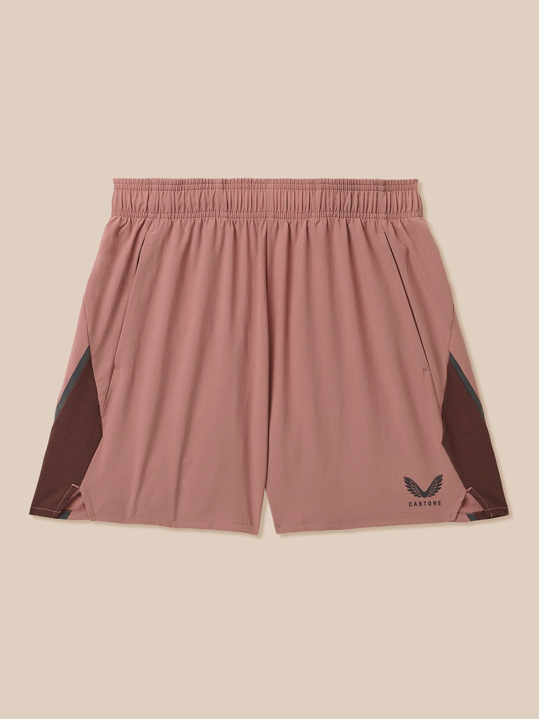 Beige men's 6 inch athletic shorts with inner brief, mesh side panels and Castore logo
