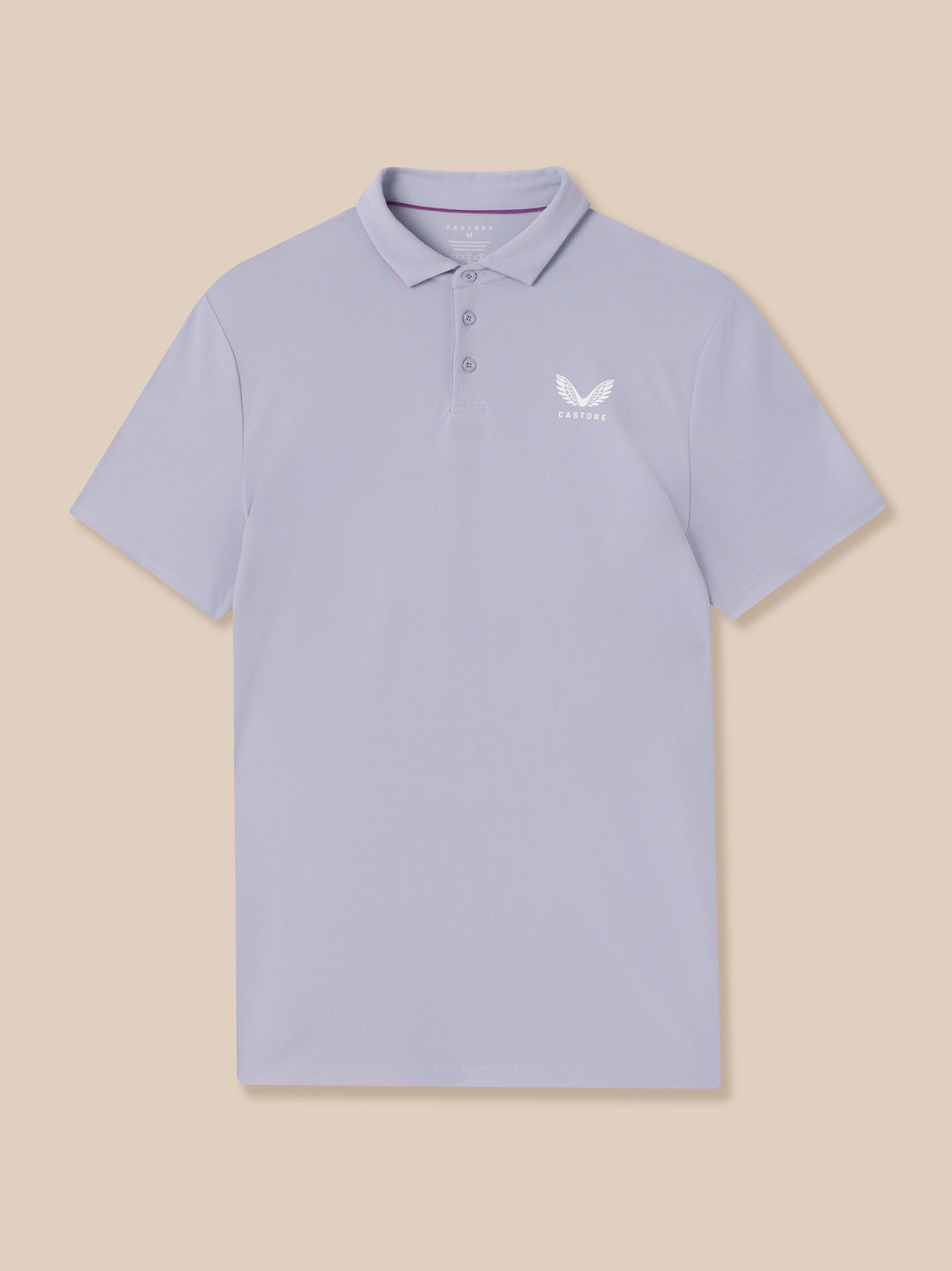 Light blue polo shirt with a logo on a beige background
