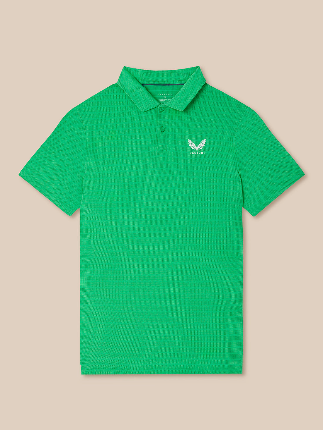 Green striped polo shirt with a Castore logo on a beige background