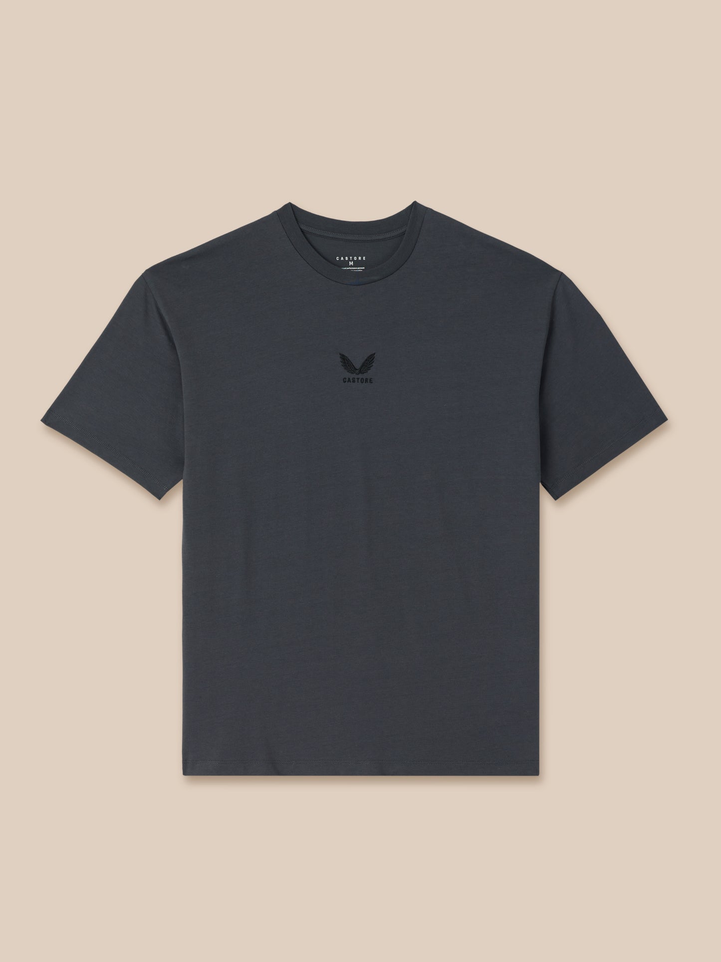 Dark gray t-shirt with a small logo on a beige background
