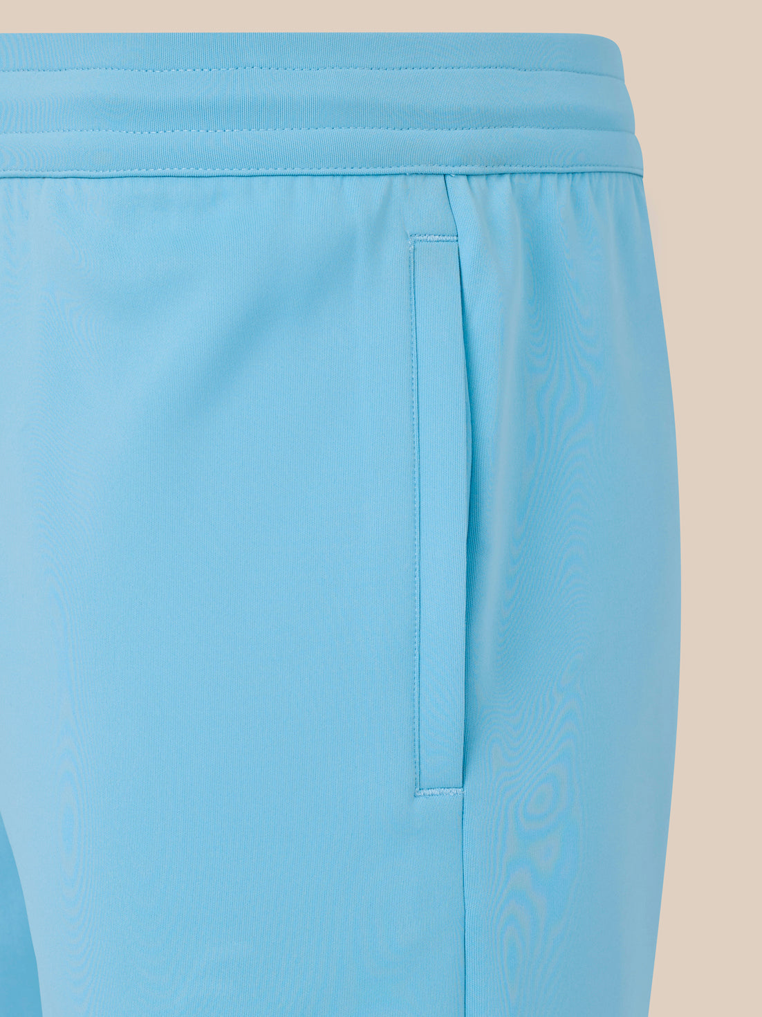Light blue shorts with a beige background