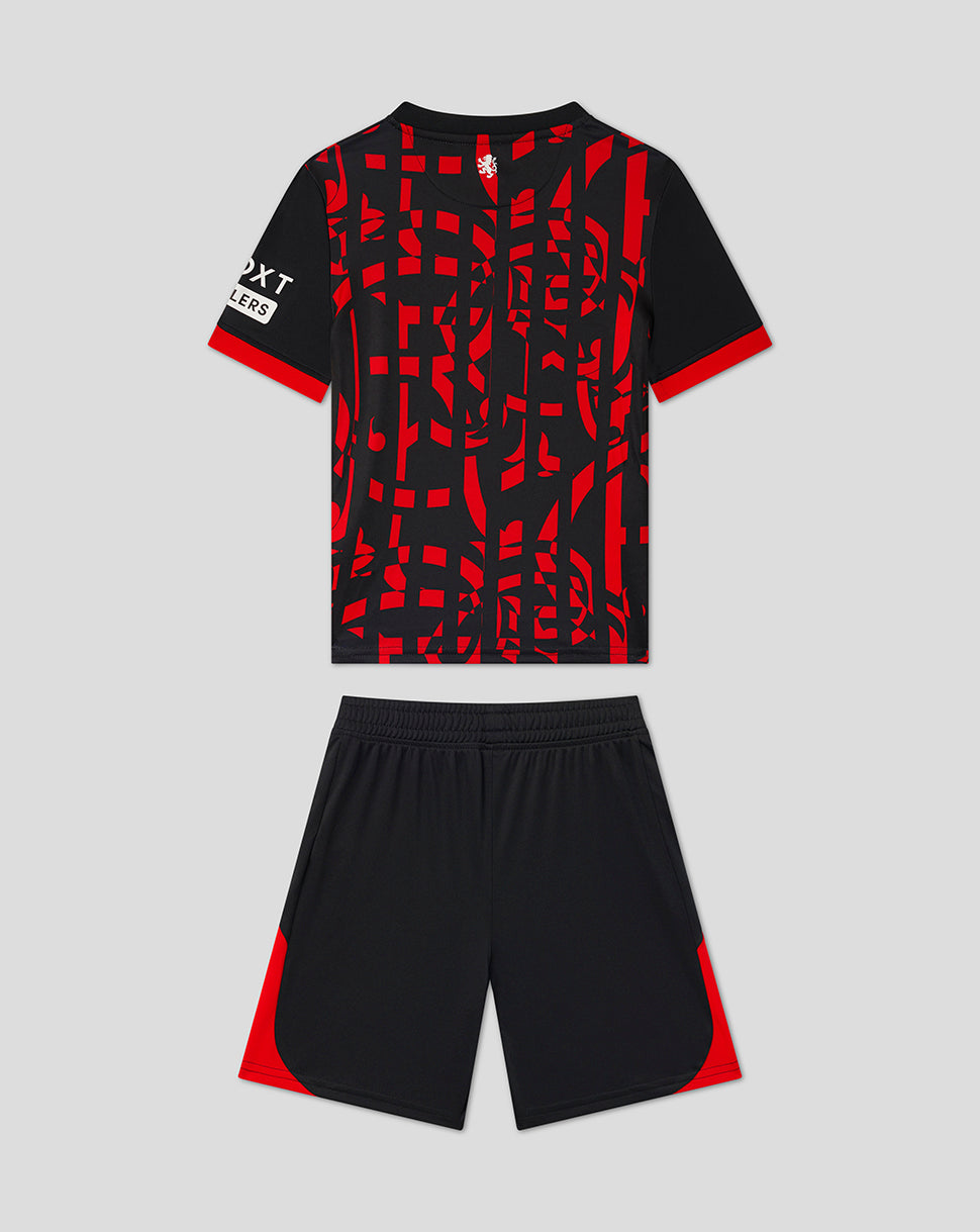 A kids' soccer kit consisting of a short-sleeve jersey and matching shorts. The jersey is black with a bold red abstract geometric pattern across the front, red sleeve cuffs, and a white logo on the right sleeve.
