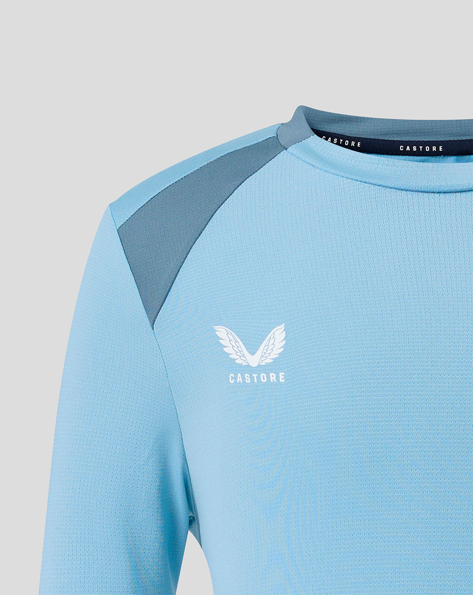 Shoulder and neckline close up of light blue FC Twente training shirt with Castore branding
