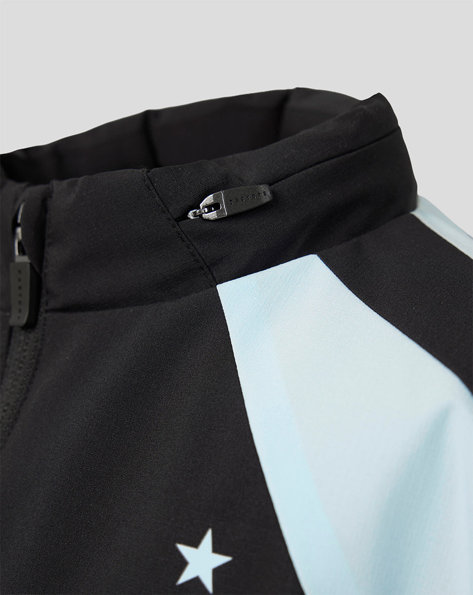 Detail of black Feyenoord training jacket with light blue panel and white star motif