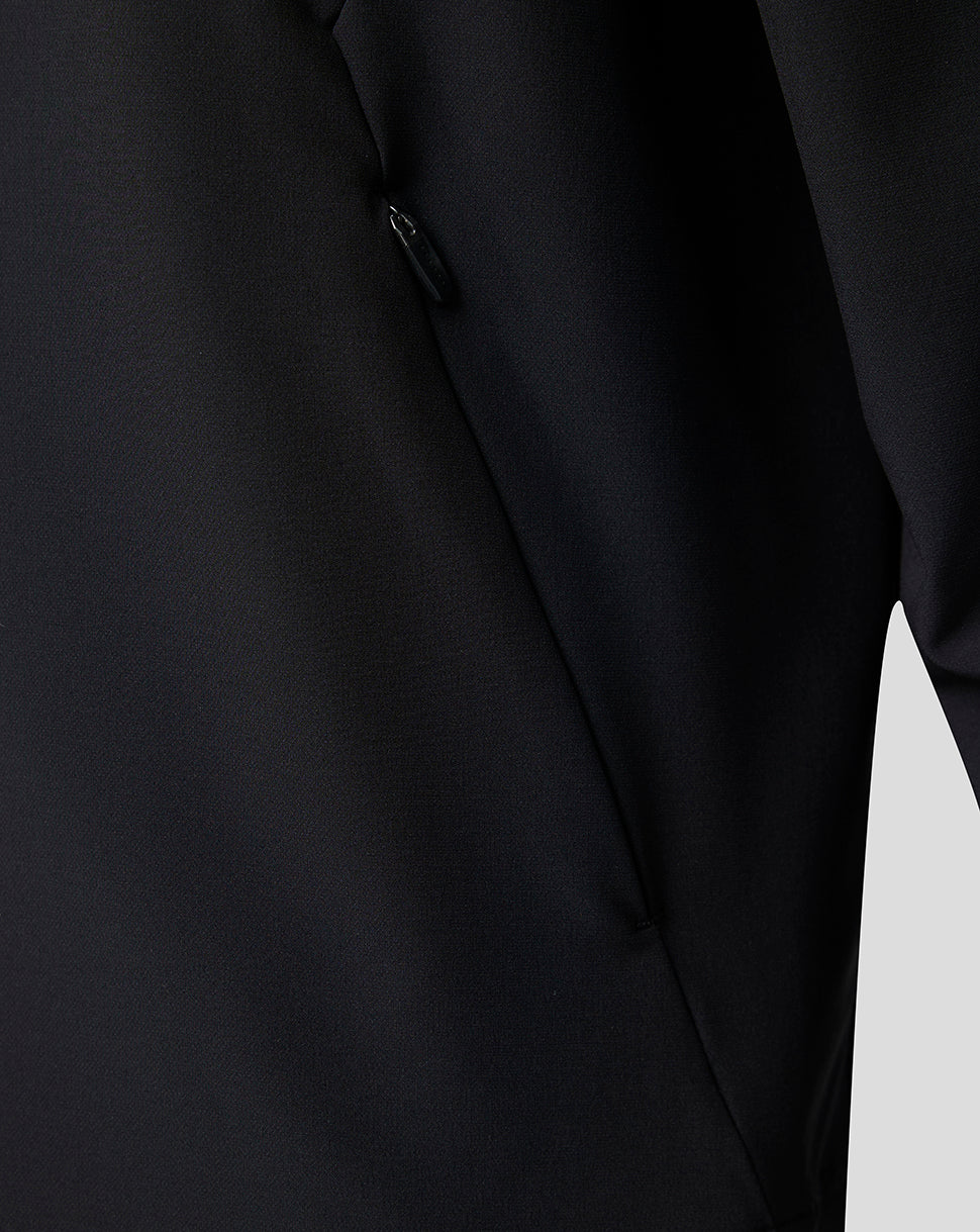 Close up of a side vertical zip pocket on the dark jacket