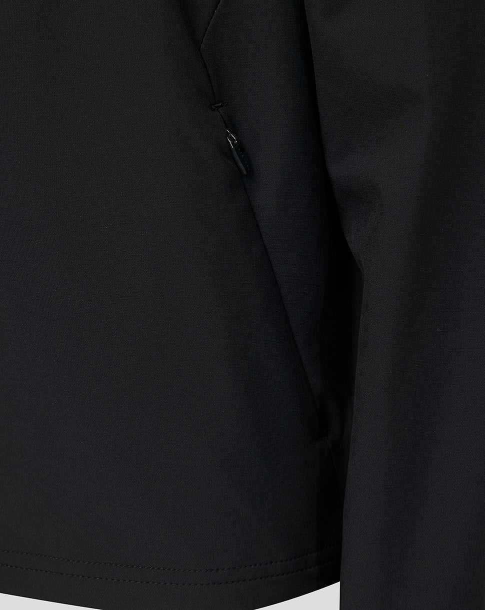 Close-up of a black Athletic Club jacket showing a side seam zipper