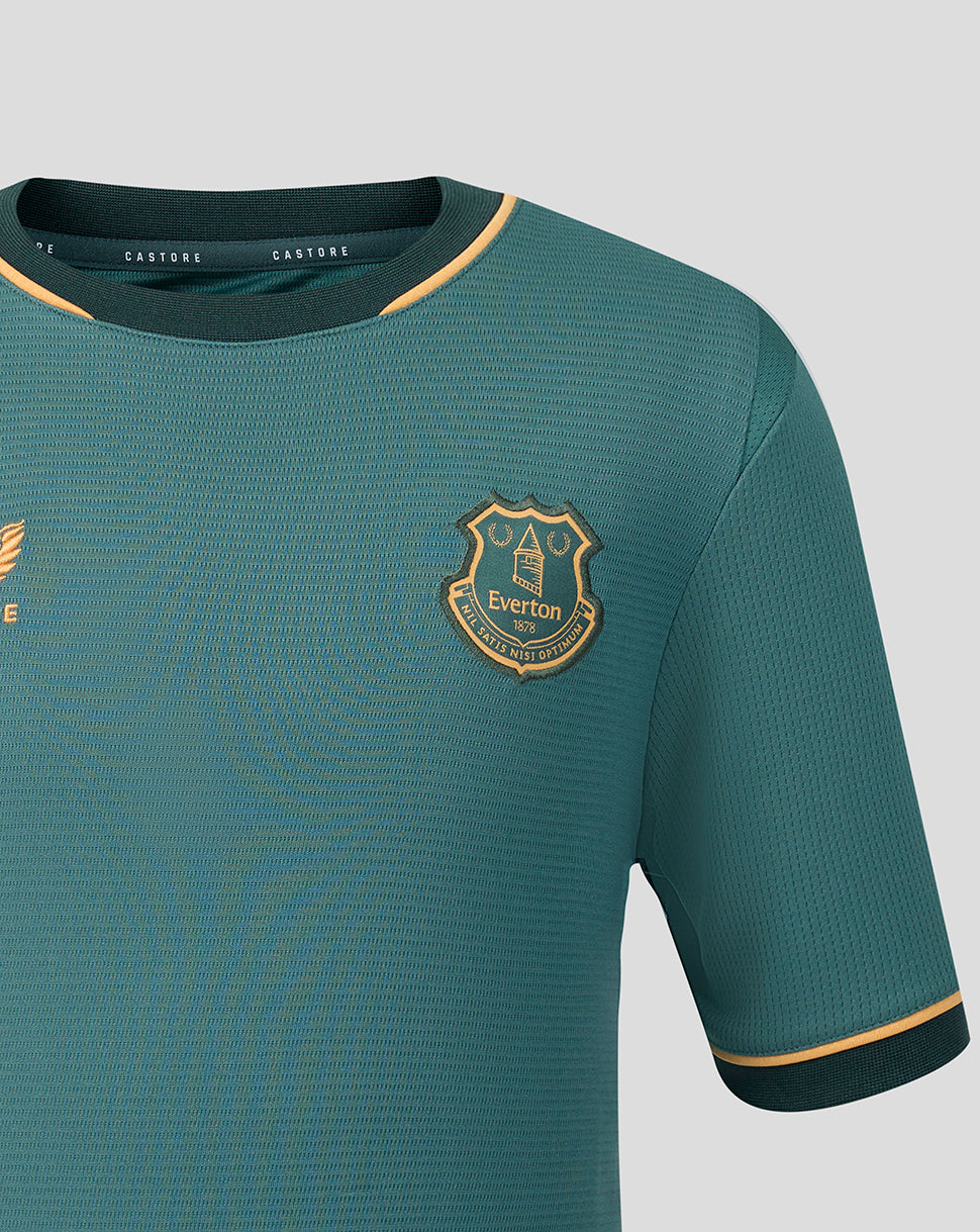 Teal Everton Junior 26/27 Third Shirt with gold crest badge on left chest and gold trim at the sleeve cuff.
