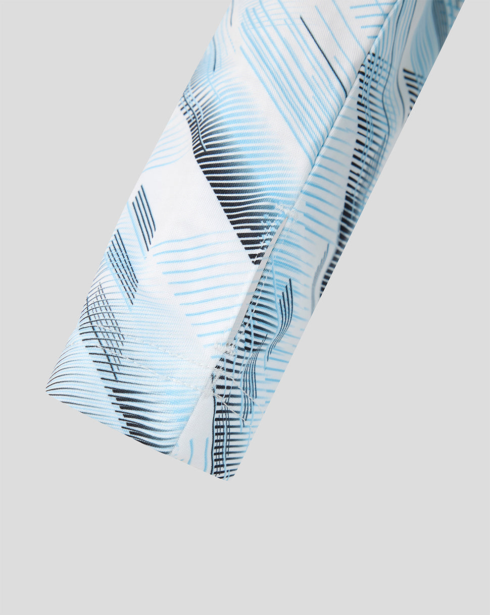 Fabric detail of Feyenoord Junior Away Midlayer showing white base with blue graphic lines