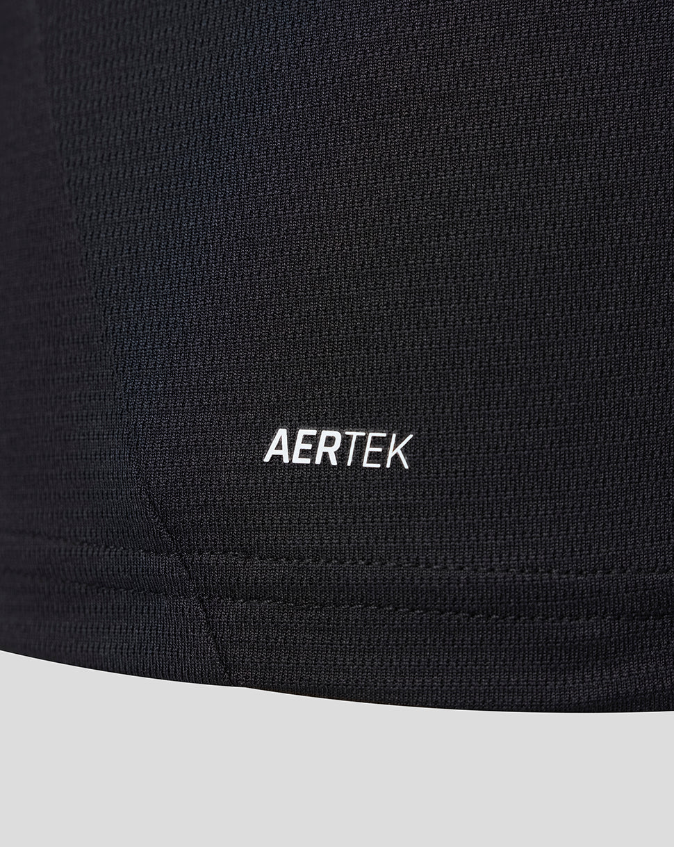 Close-up of the dark jersey fabric with AERTEK branding on the lower side