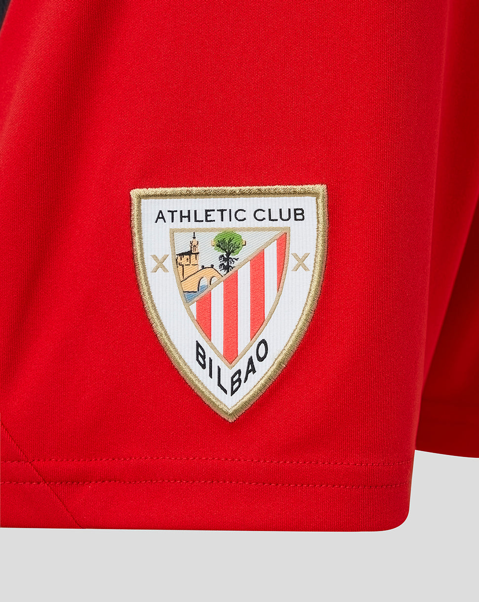 Red junior away shorts featuring the Athletic Club Bilbao crest badge.