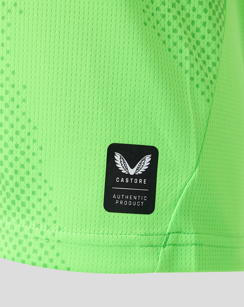 Neon green FC Utrecht goalkeeper jersey close up showing Castore authentic product patch on the side