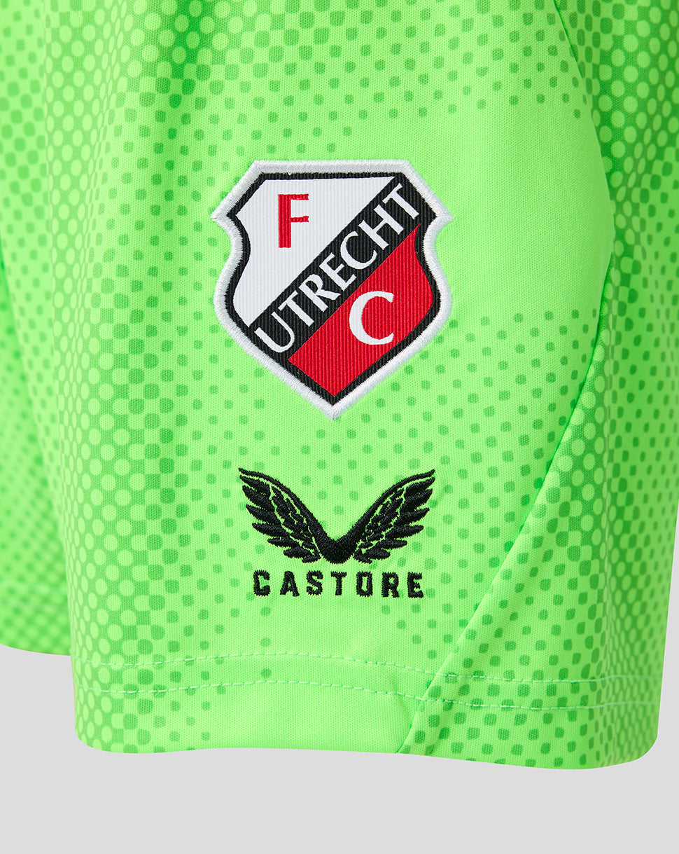 Close-up of neon green junior FC Utrecht keeper shorts showing the team crest and Castore branding
