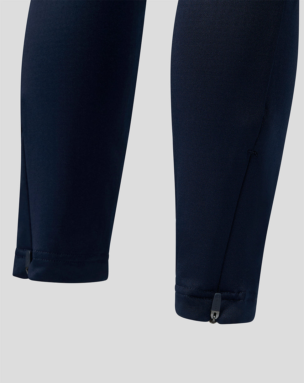 Close up of navy training pants cuffs with ankle zippers for a secure fit