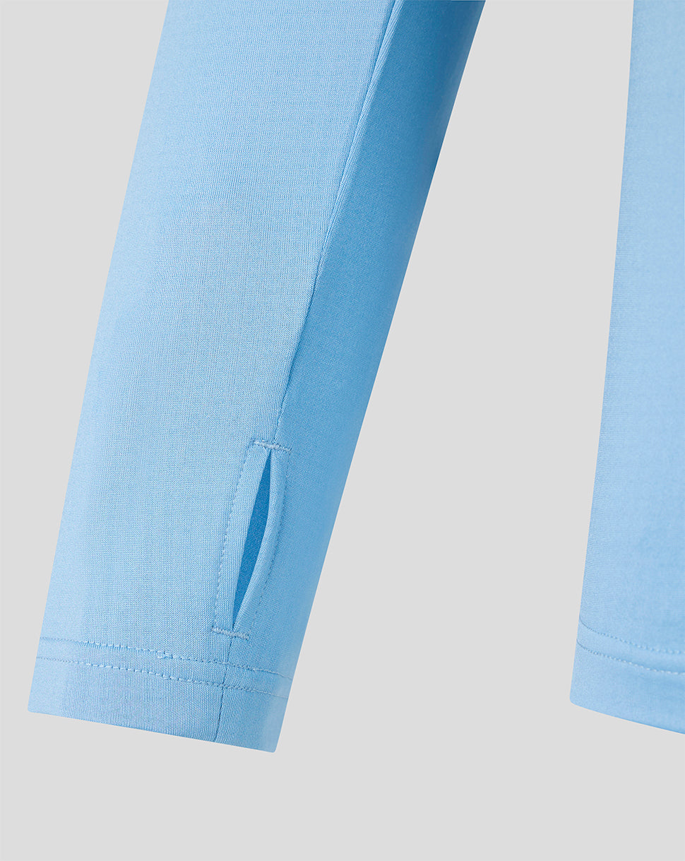 Sleeve detail of light blue FC Twente training midlayer with a small vent slit at the cuff