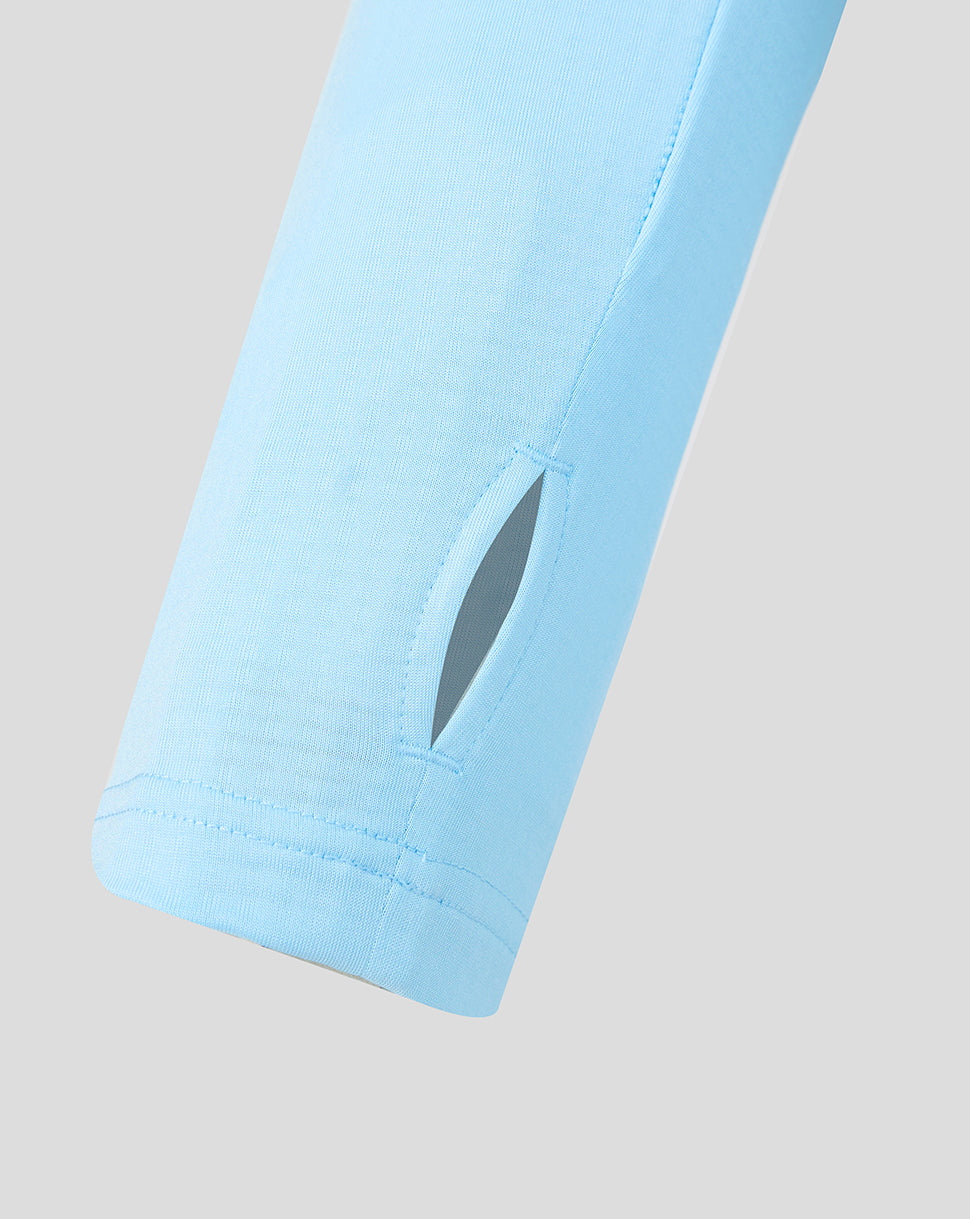 Close-up of the light blue sleeve with a small vent opening on the Feyenoord training top