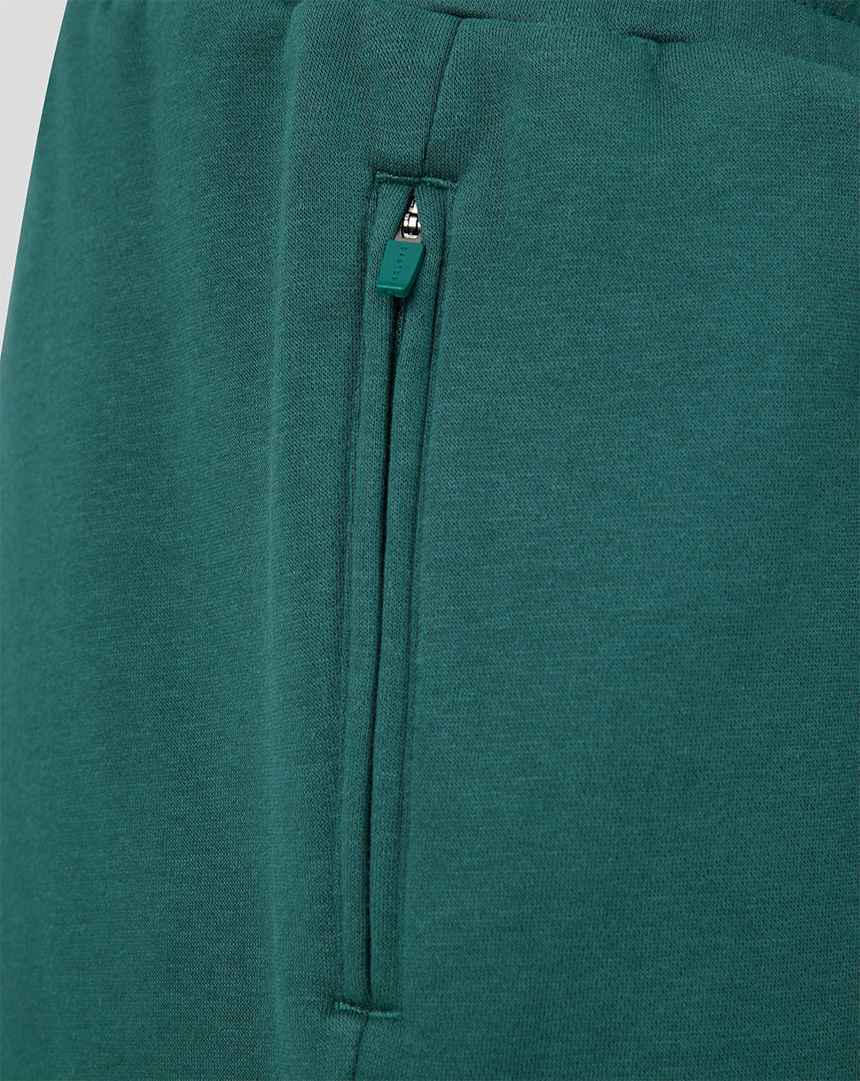 Detail of side zip pocket on green shorts
