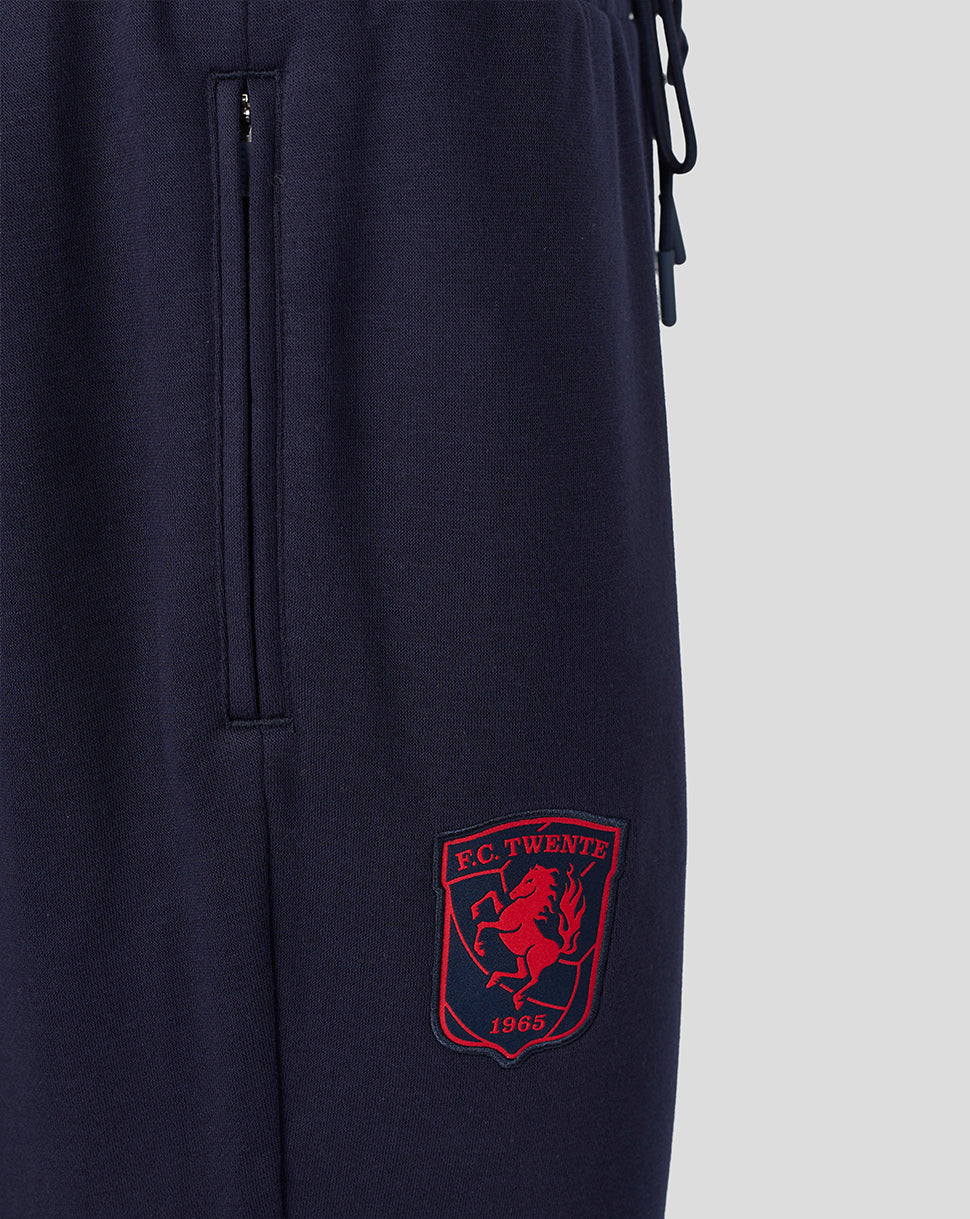 Navy FC Twente travel fleece track pants with a zip side pocket and the red club crest on the leg