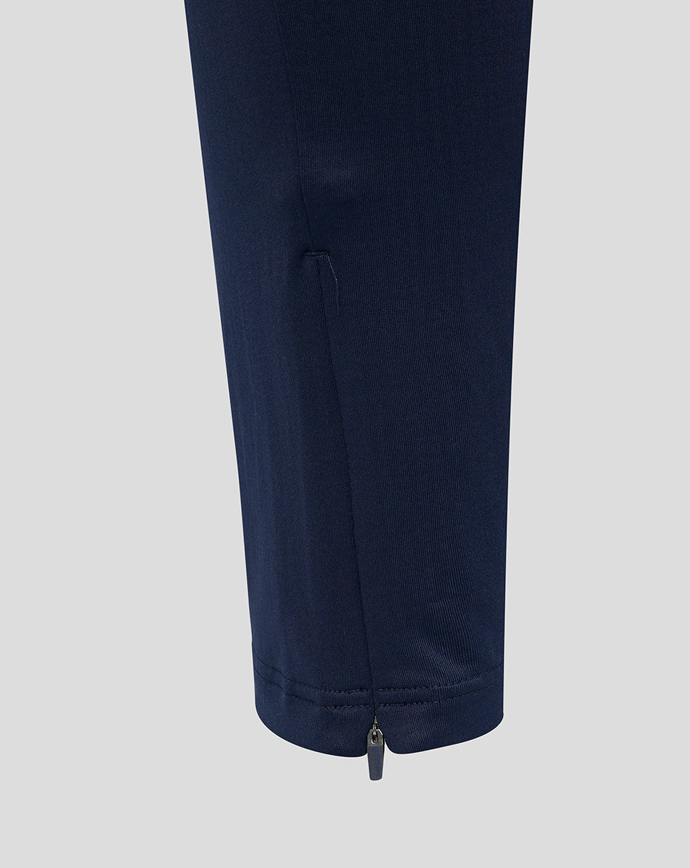 Navy Athletic Club training pants leg with a zipper at the cuff.