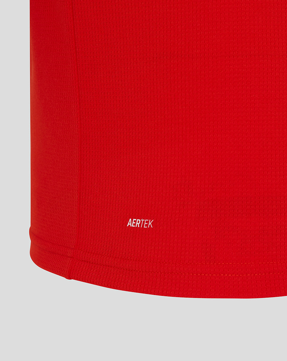 Close-up of a red fabric with 'AERTEK' branding on a gray background