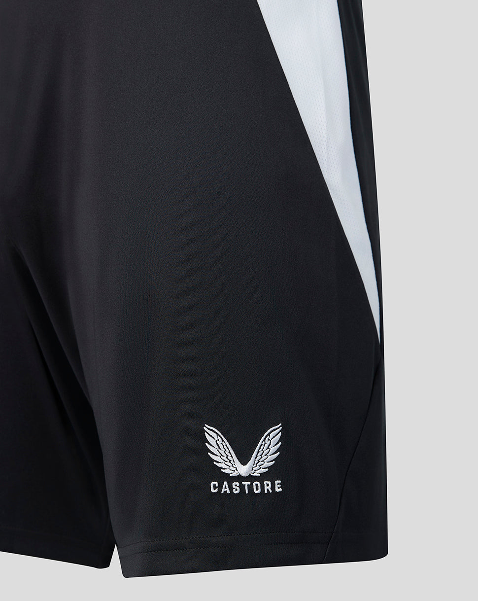 Castore logo on black shorts with a white side stripe detail.