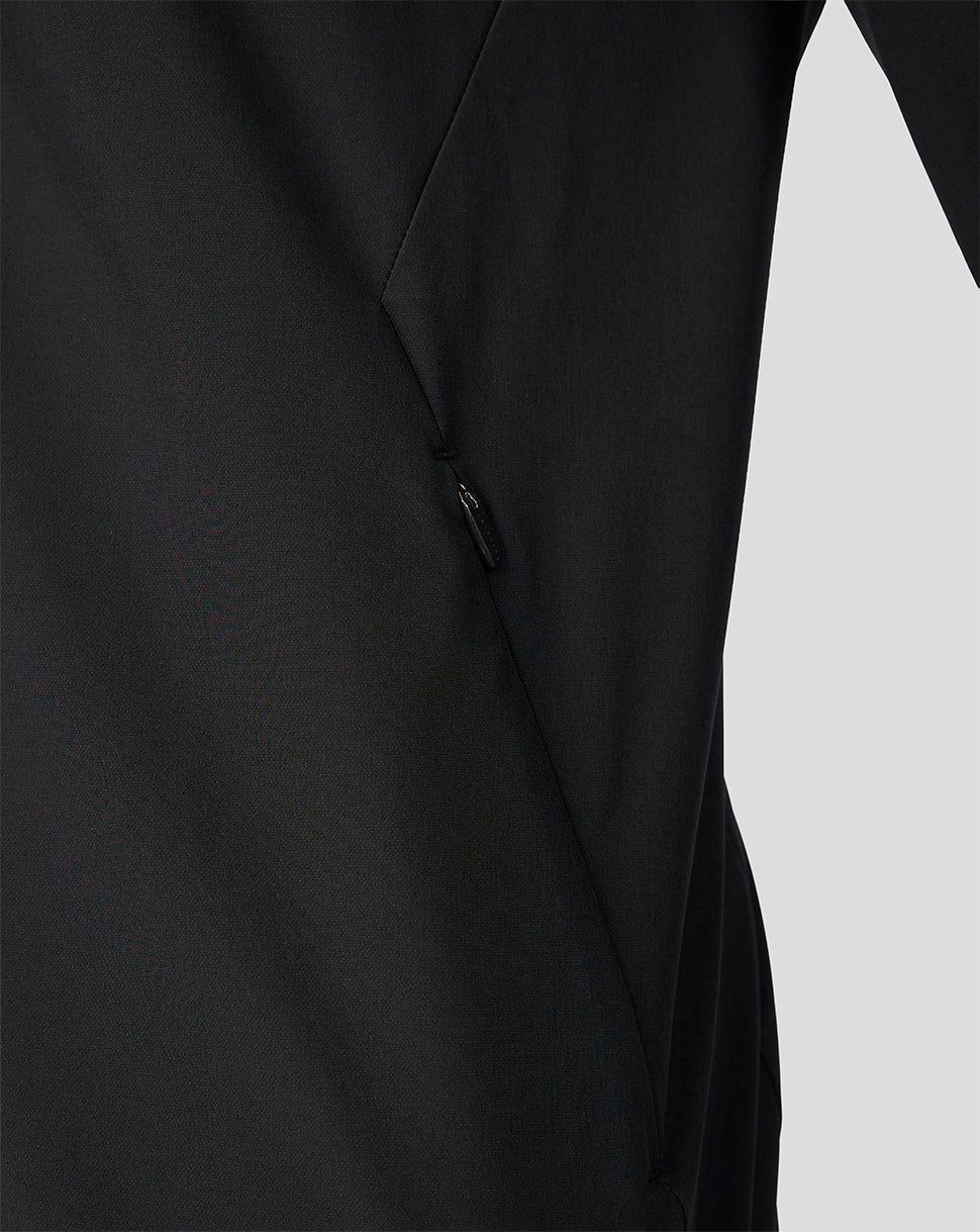 Close up of black Feyenoord home matchday jacket fabric with a side zip pocket