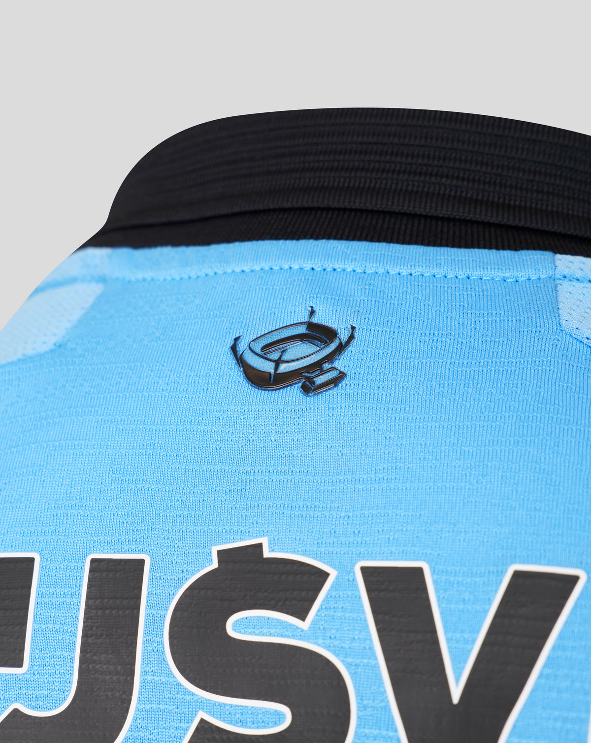Close up of Feyenoord 2026-27 away shirt fabric with blue body and dark trim