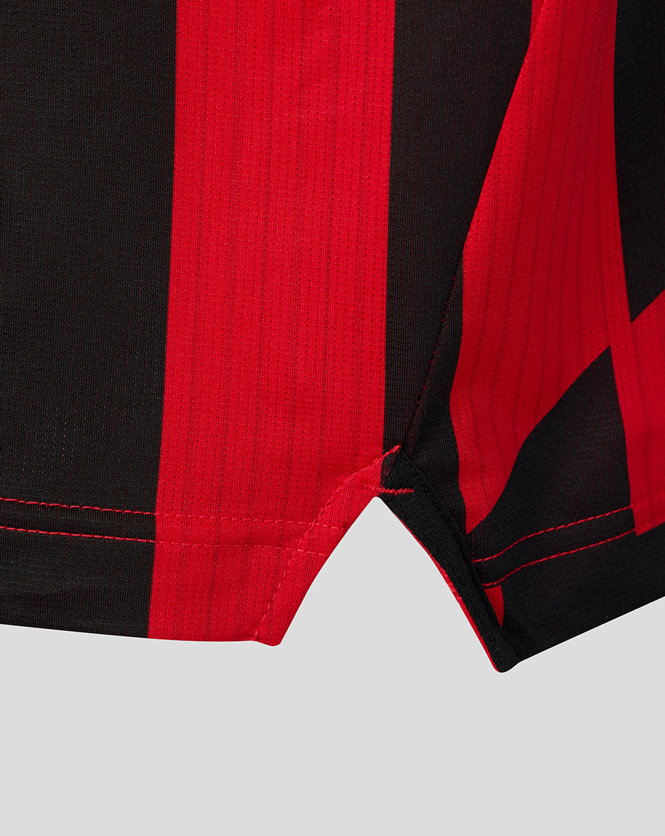 Hem and sleeve edge of red and black striped Athletic Club matchday shirt.
