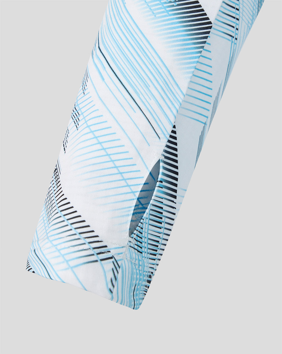 Close up of the Feyenoord 2026-2027 away midlayer sleeve showing light blue geometric pattern and diagonal lines