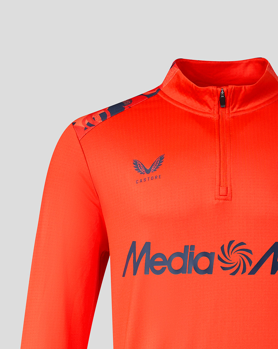 Close up of red Feyenoord midlayer highlighting Castore logo on the chest and the Feyenoord crest