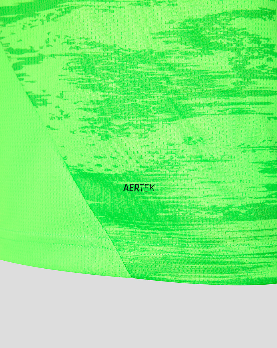 Neon green fabric close-up from the Feyenoord training shirt with AERTEK branding
