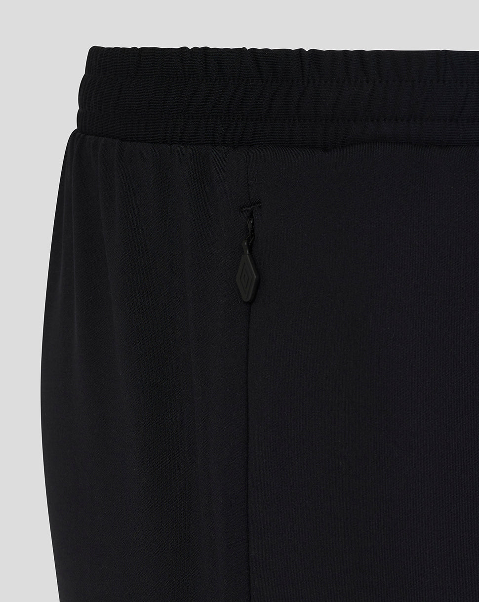 Black pants with a drawstring on a light gray background