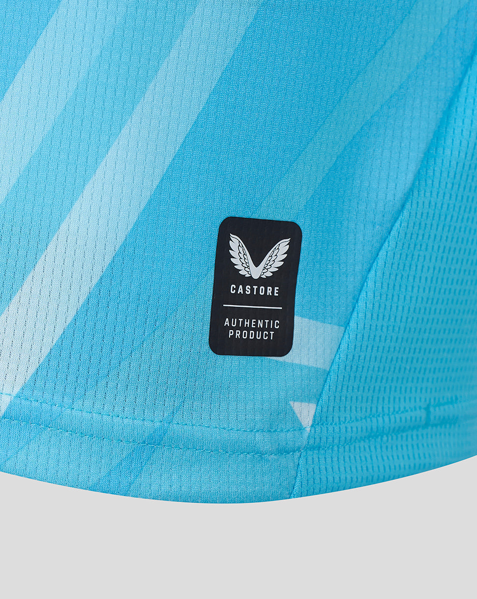 Close-up of Athletic Club Third Shirt fabric in blue tones with a Castore authentic product badge.