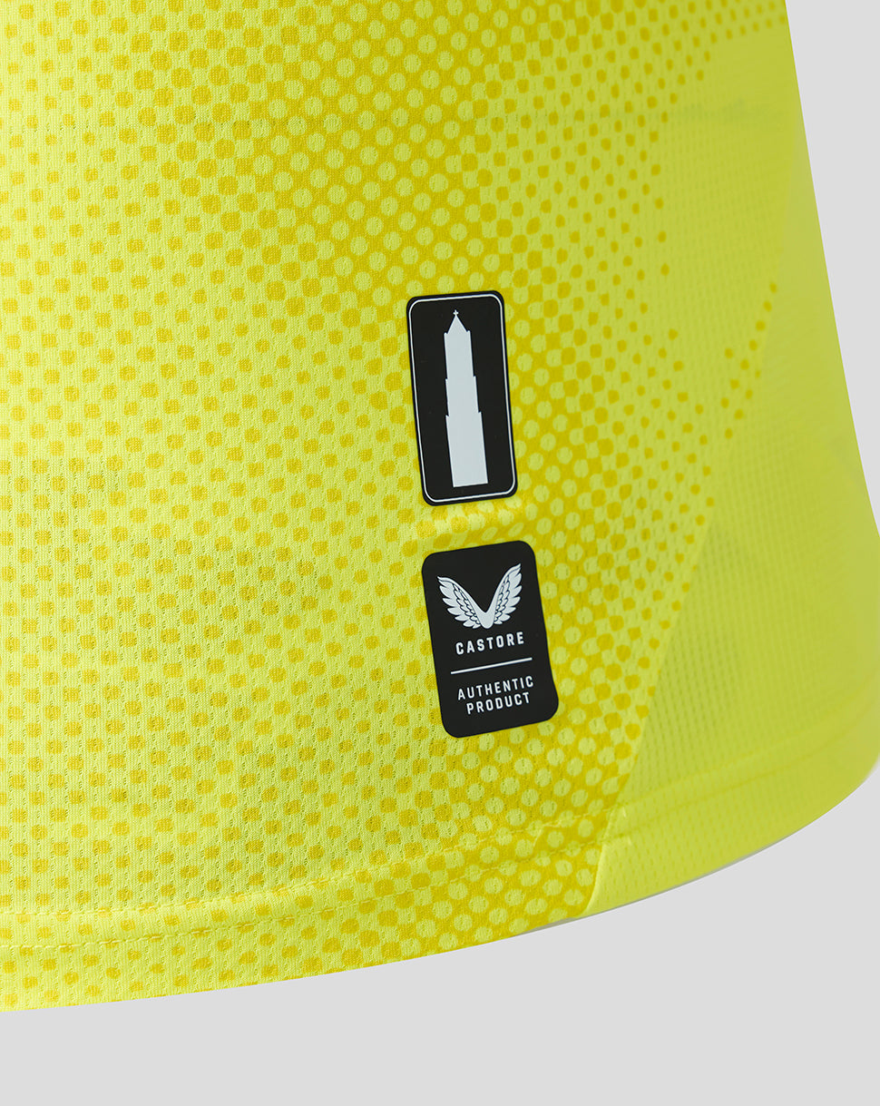 Close-up of the yellow FC Utrecht away goalkeeper shirt showing Castore authentic product patch and logo sticker
