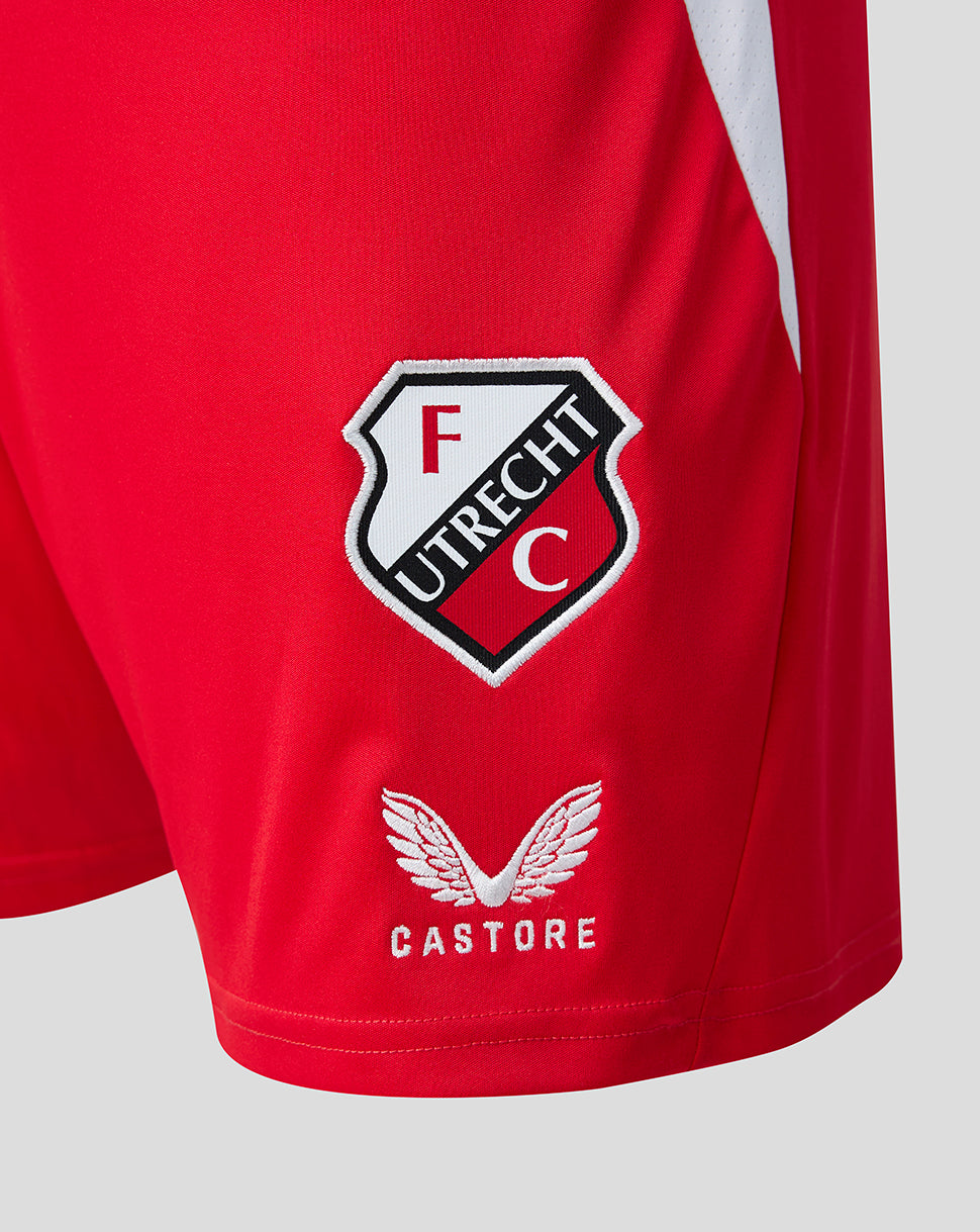 Close-up of FC Utrecht crest and Castore logo on red shorts