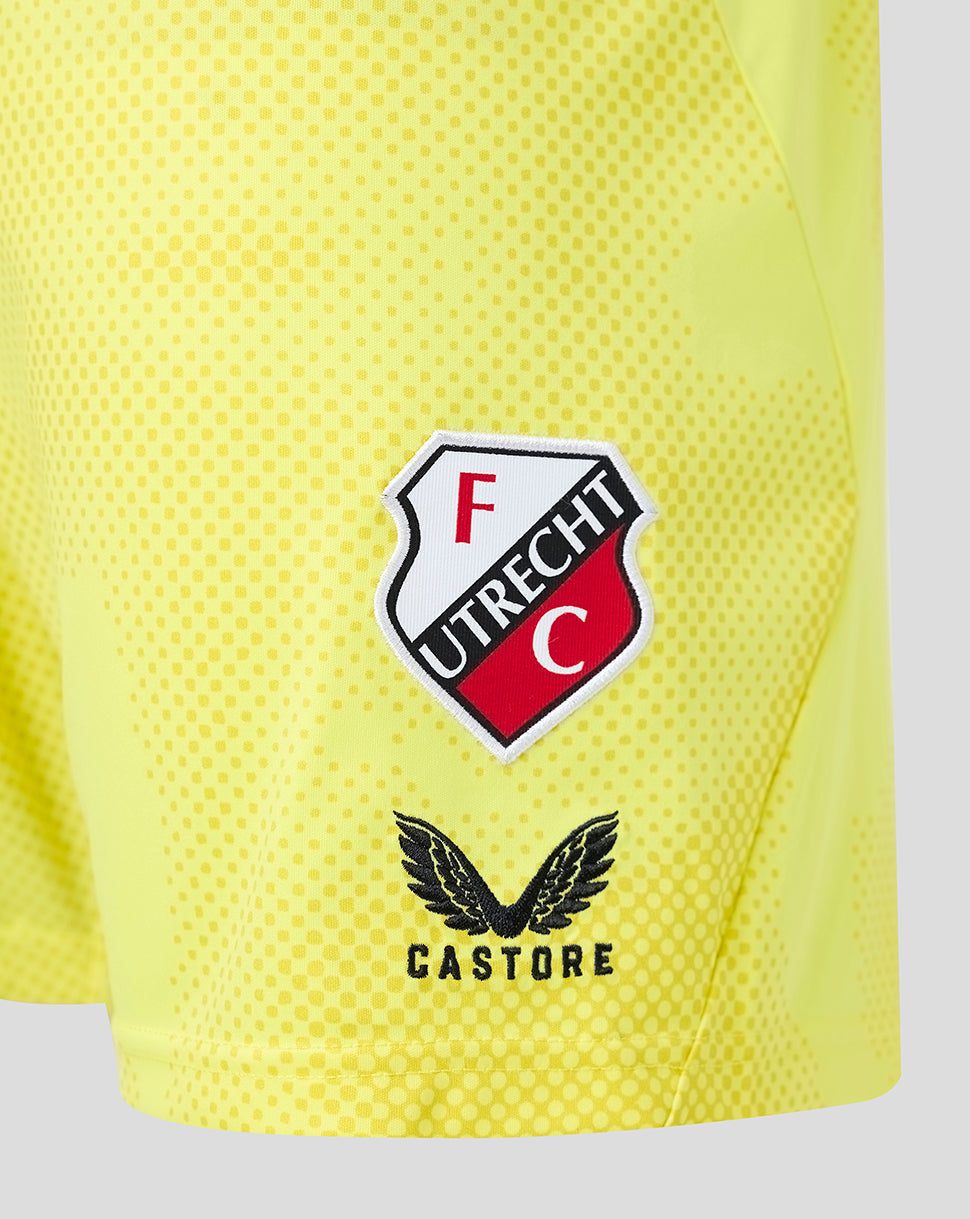 Close up of neon yellow FC Utrecht shorts featuring the club crest and Castore branding