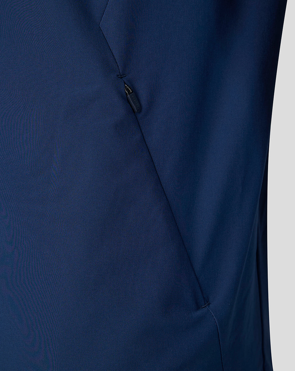 Close up of side zip pocket on navy Athletic Club jacket