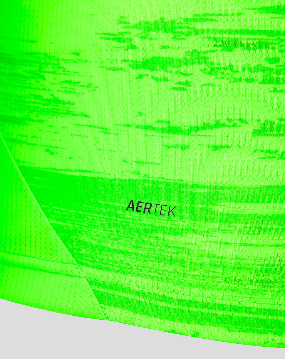 Detail of neon green away jersey showing AERTEK textile marking on the lower panel