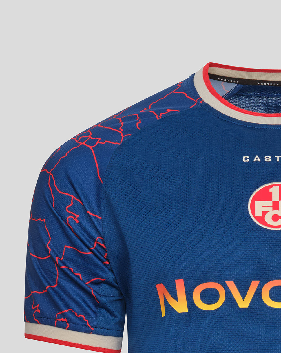Close-up of the blue away shirt neckline with red map lines on the shoulder and CASTORE branding near the collar.