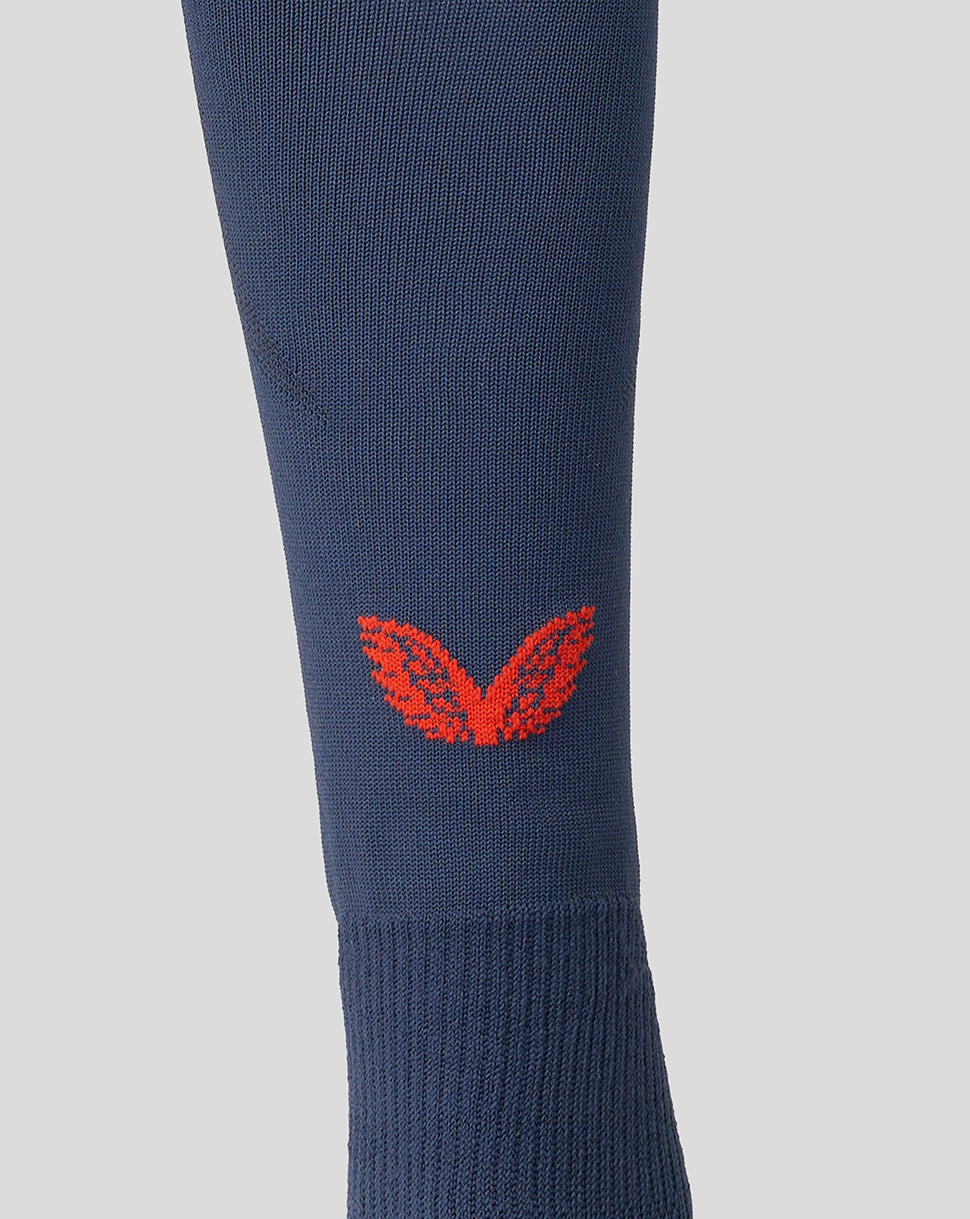 Close-up of navy Feyenoord third sock with red Castore logo on calf