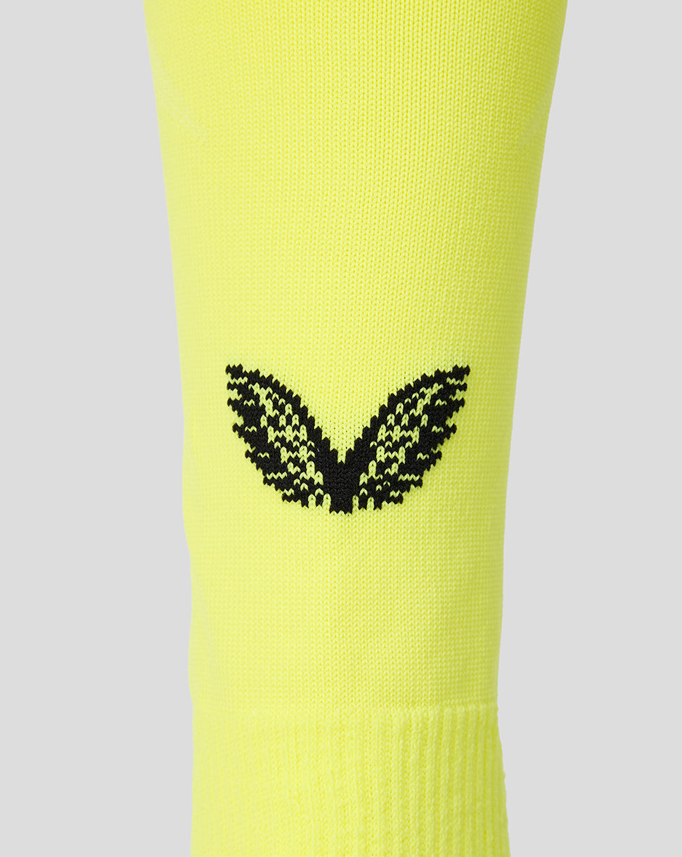 Neon yellow Feyenoord away goalkeeper sock with black F crest and Castore logo.
