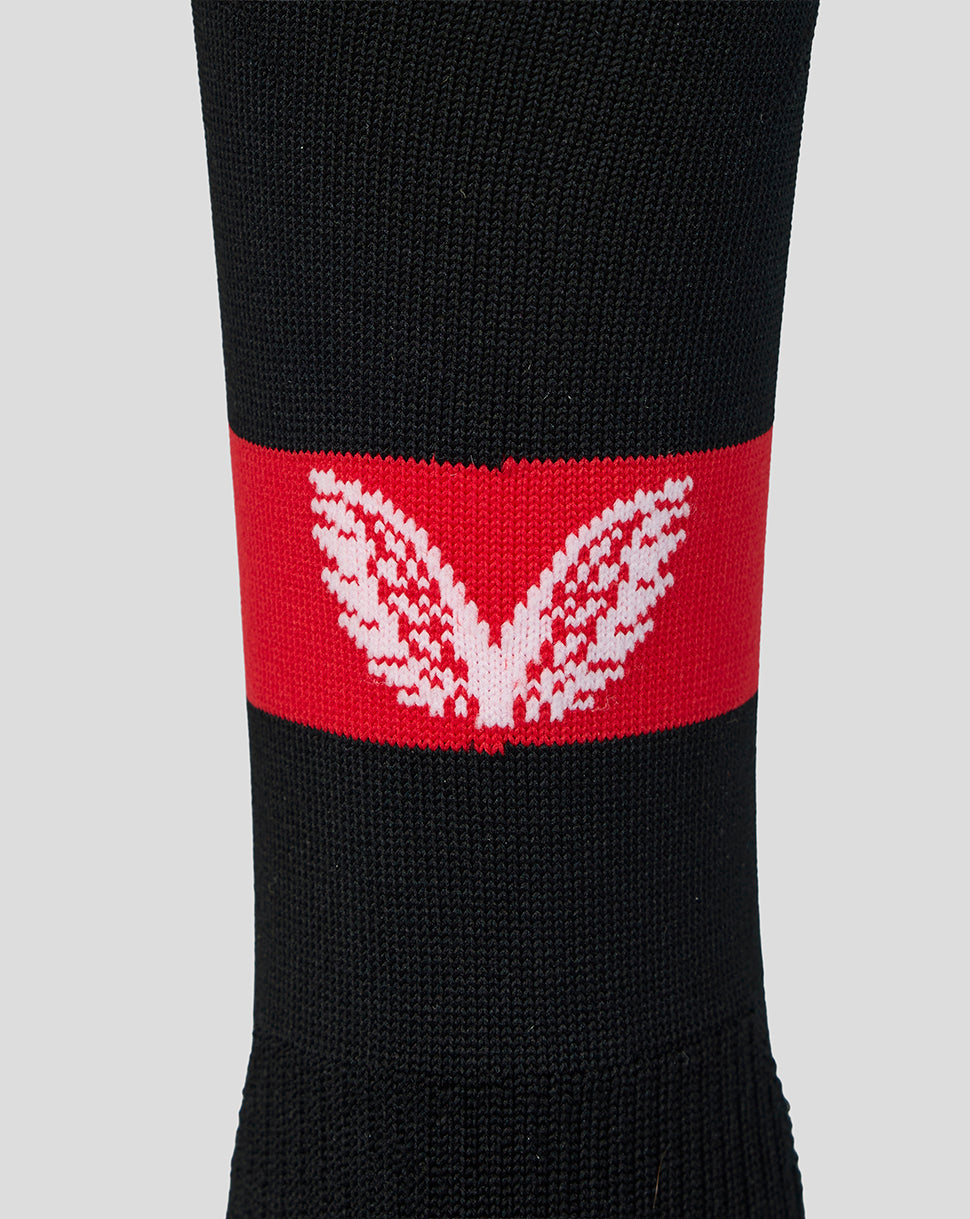 White wing logo on a red band around the sock.