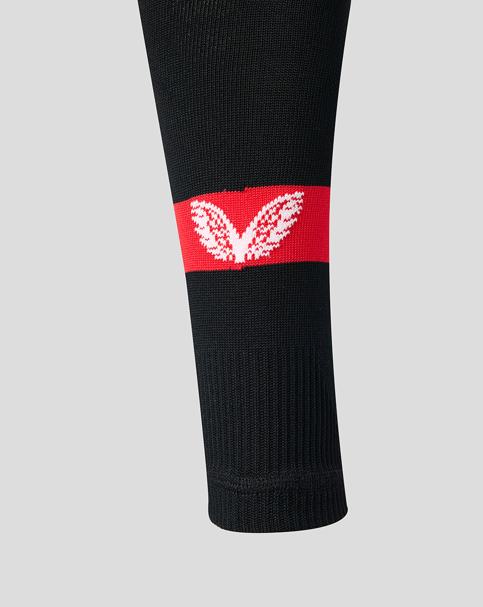 Red stripe with white leaf emblem on a black Athletic Club sock.