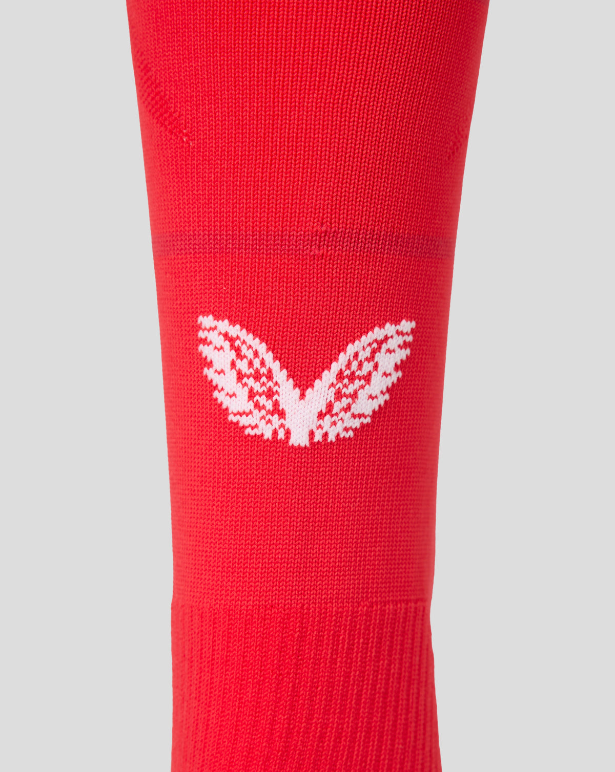 Red FC Twente home sock with white knitted crest near the ankle area