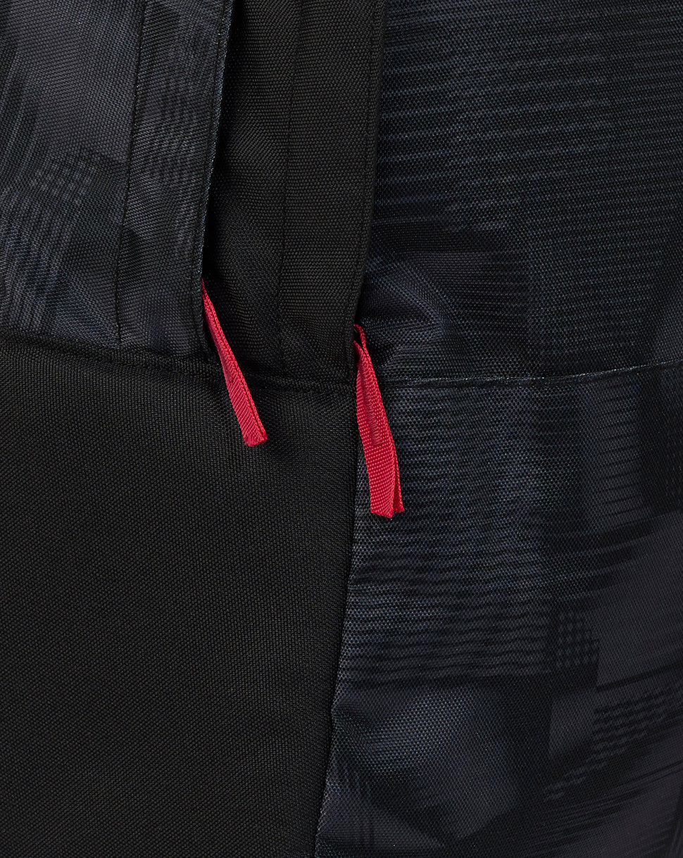 Close-up of a black bag with red drawstrings on a dark background