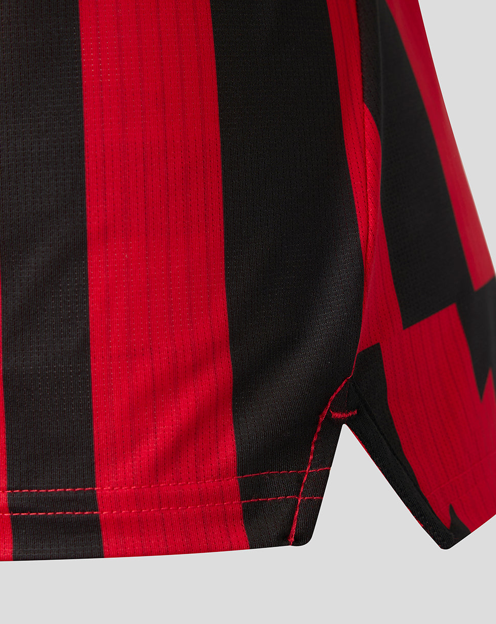 Close-up of red and black striped fabric and hem on the Athletic Club matchday shirt.