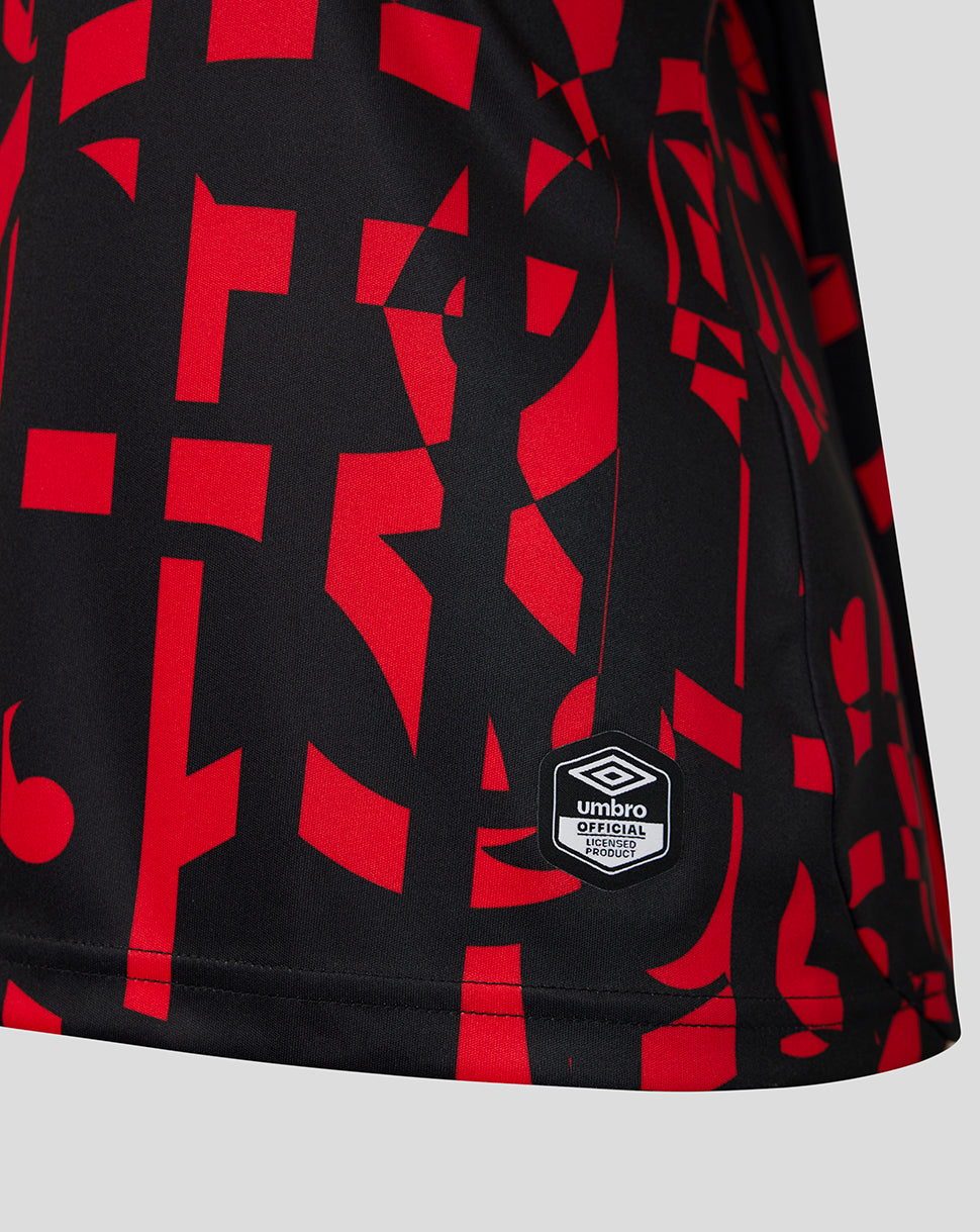 Black and red patterned top with Umbro logo on a gray background